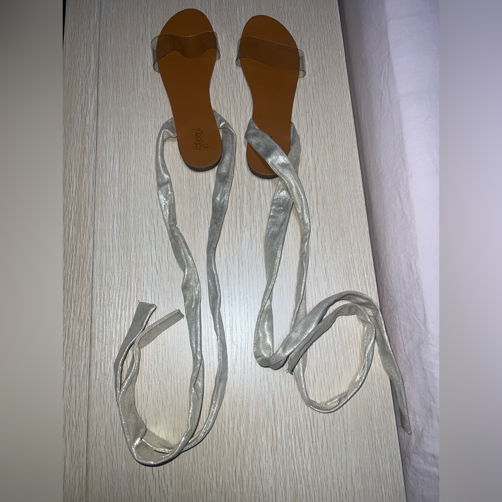 Tie up sandals , gold straps , clear foot strap